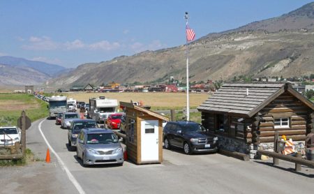 Congestion due to high visitor volumes at the Yellowstone North Entrance station often backs up outside of the park.