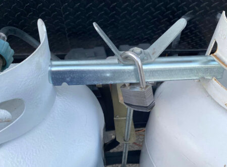 Simple padlock solution to secure  RV propane tanks.